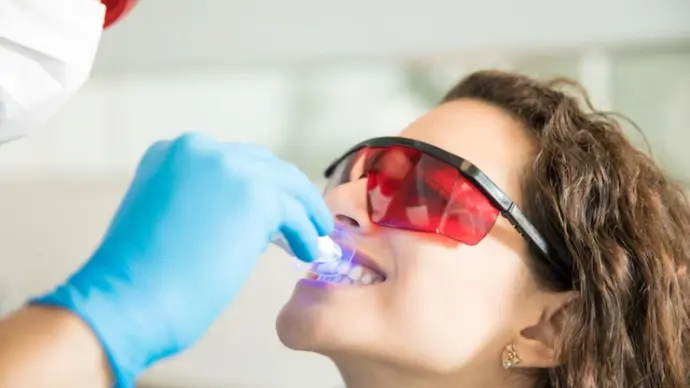 teeth whitening is being performed by a dentist in Paradise Valley, AZ